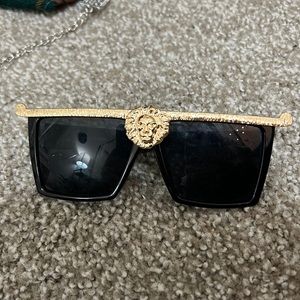 Gold and black sunglasses